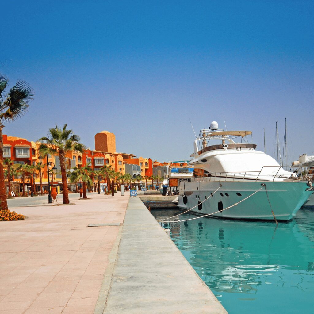 Colourful buildings and white ship for all-inclusive holidays Hurghada